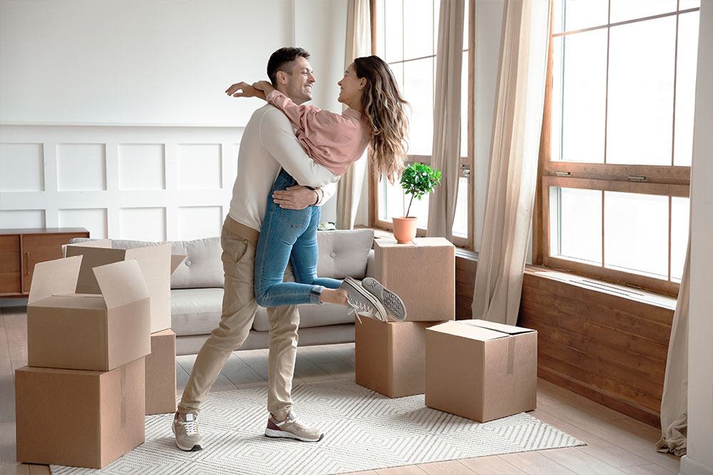 Young Couple Excited About Moving Into New Home Tax & Accounting