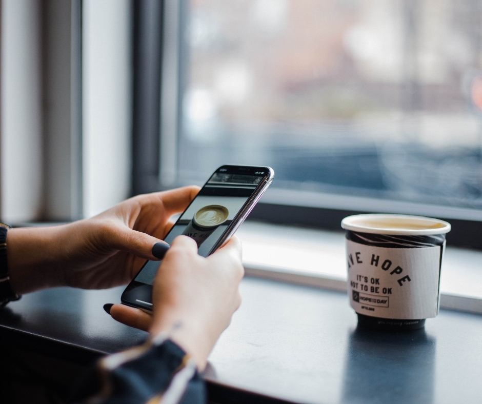 Person Taking A Photo Of A Cup On Smartphone Person Taking A Photo Of A Cup On Smartphone