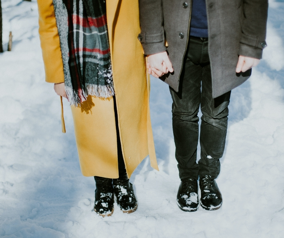 Lower Half Of Two People Standing In Snow Lower Half Of Two People Standing In Snow