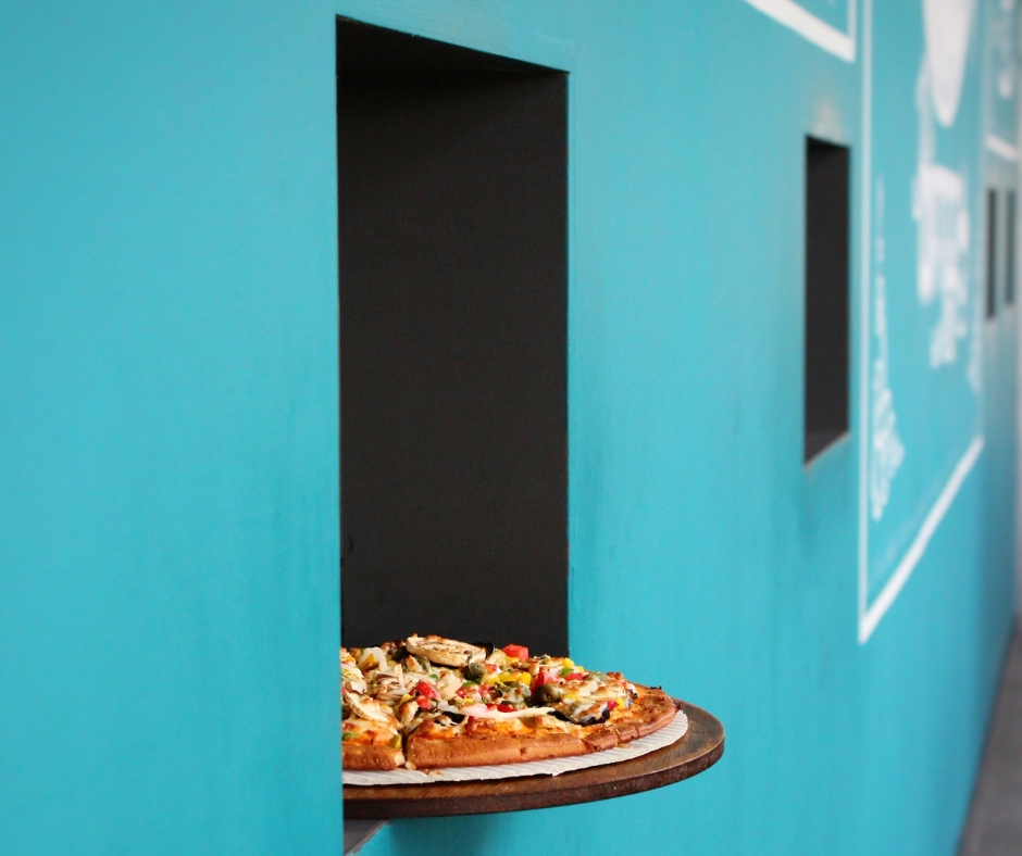 Pizza Sticking Out of Pizza Window Pizza Sticking Out of Pizza Window