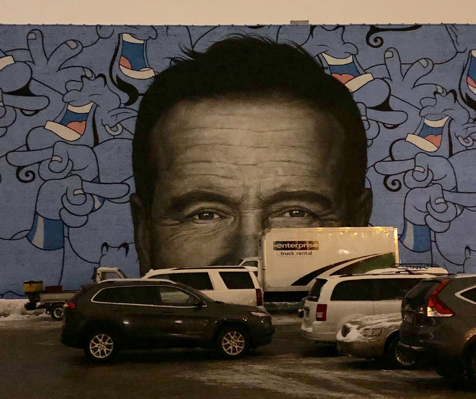 Cars In Front of Wall Painted With Robin Williams’ Face & Genie From Aladdin Cars In Front of Wall Painted With Robin Williams' Face & Genie From Aladdin