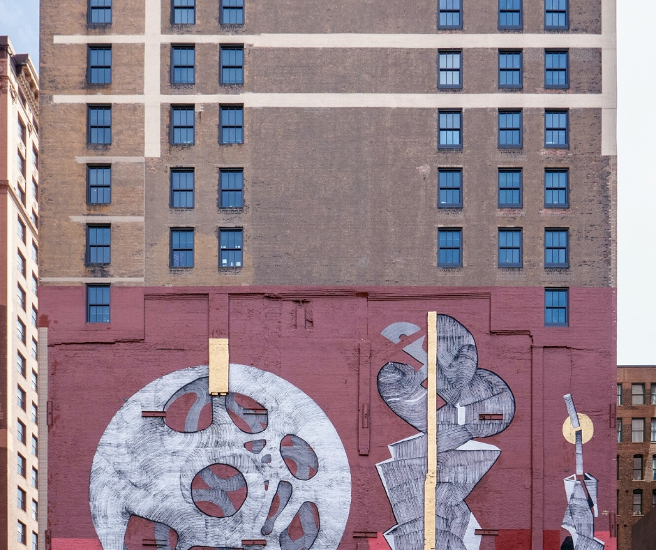 Side Of A Building With Painting On It Side Of A Building With Painting On It