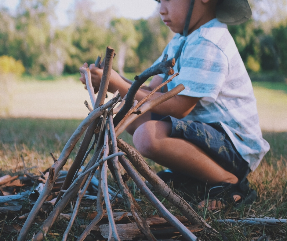 Child Building A Campfire Child Building A Campfire